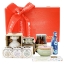 Red pine wooden gift box with a swing lid filled with Greek gourmet food products.